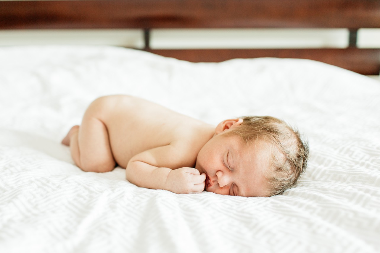 Newborn lifestyle session - newborn image from his side
