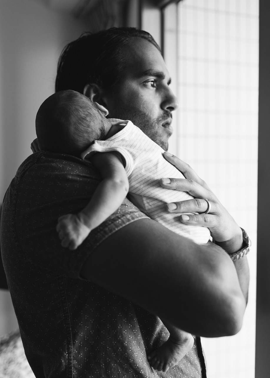 lifestyle newborn photoshoot in Kennedy Town - baby in dad's arm in Black and white