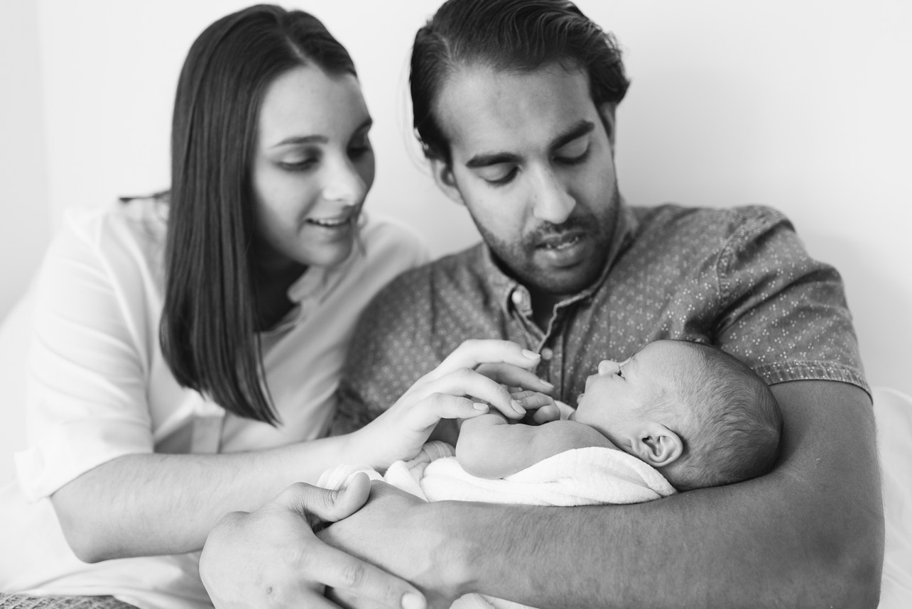 lifestyle newborn photoshoot in Kennedy Town - black and white family pic with a baby