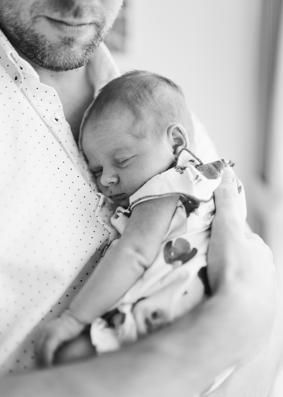 Newborn Home Session in Discovery Bay Hong Kong - black and white baby in dad's chest