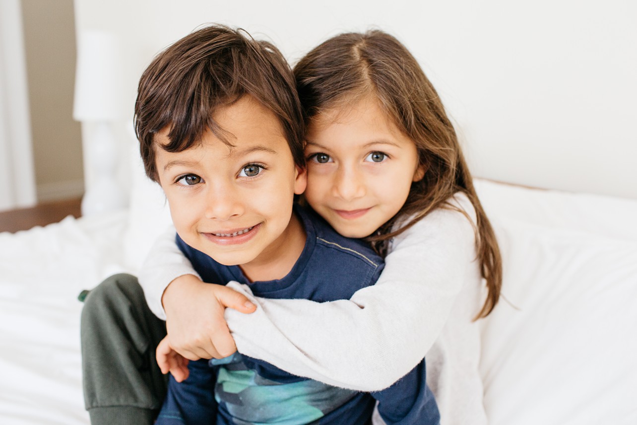Cozy Family Session - big brother and big sister are hugging