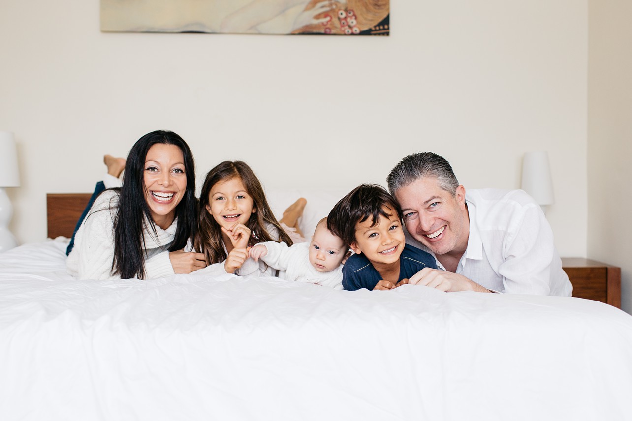 Cozy Family Session - family smiling and looking at the camera