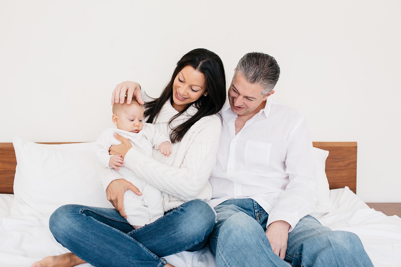 Cozy Family Session - mom and dad smiling at their little boy