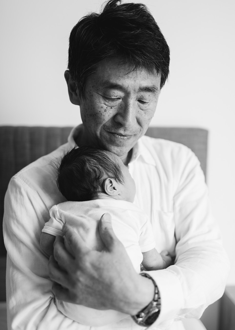 Relaxing Indoor Newborn In NT - black and white of baby with his grandpa