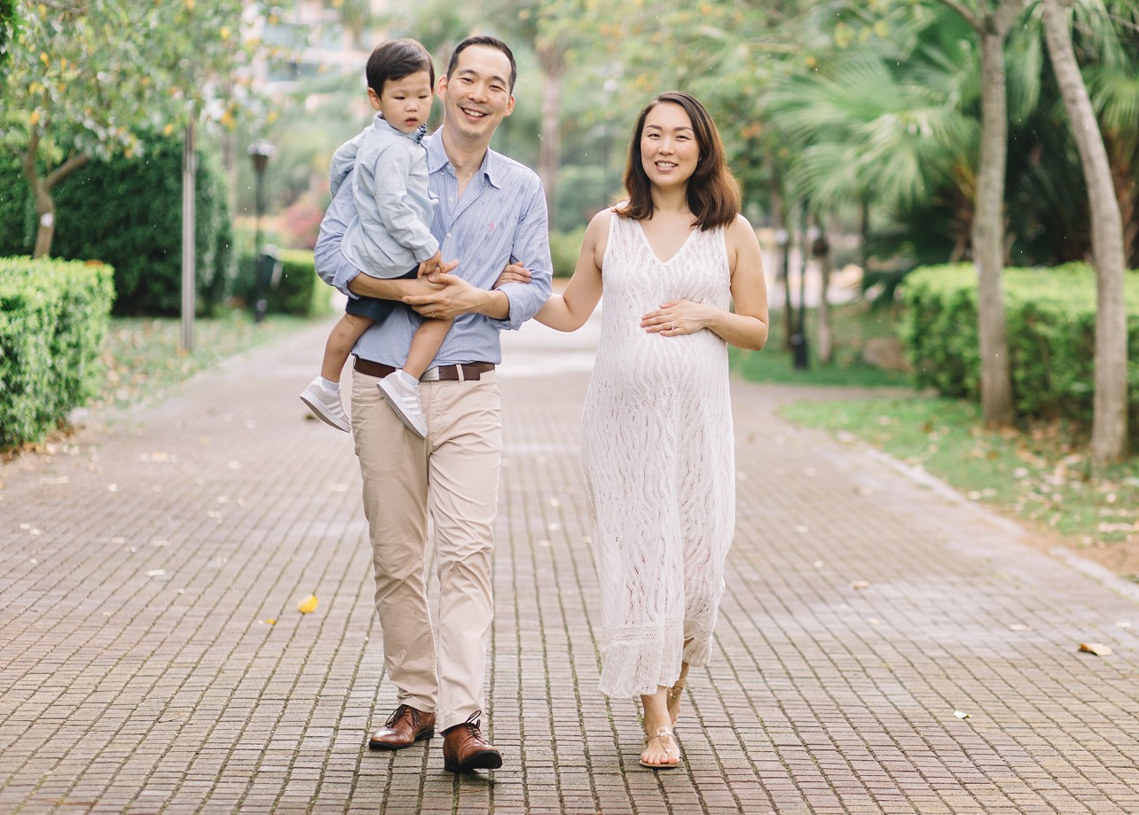 Central Park Maternity Session in Discovery Bay - Parents and a boy walking in the park
