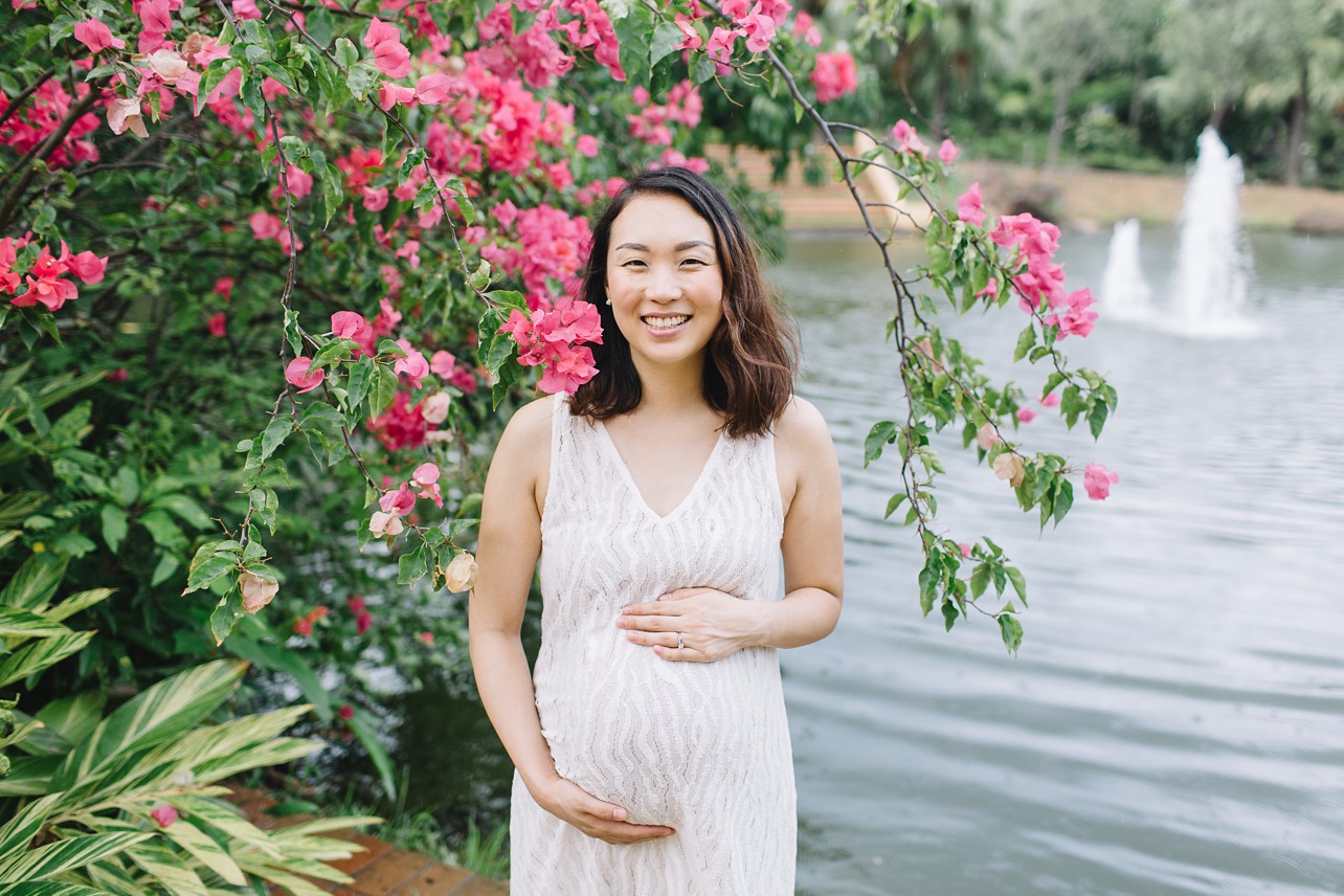 Central Park Maternity Session in Discovery Bay - pregnant mother and pink flowers in the park