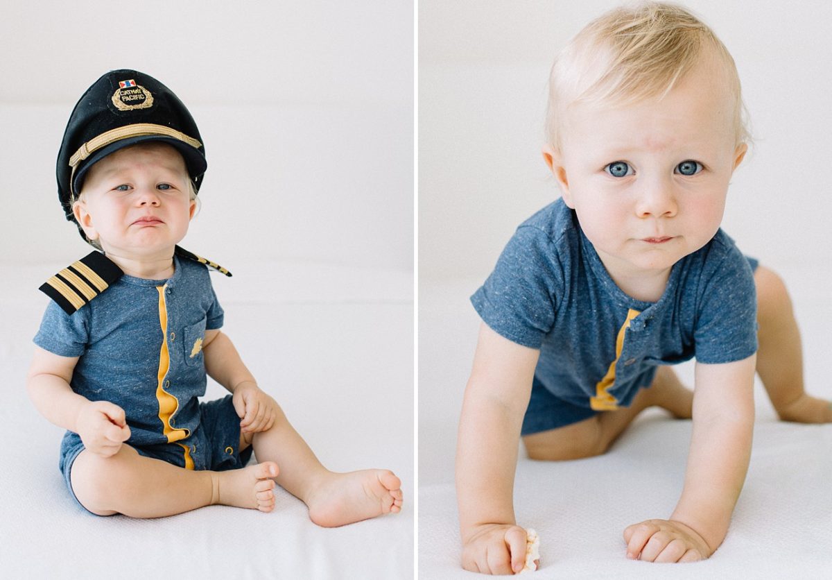 little boy is in pilot uniform and wearing its hat