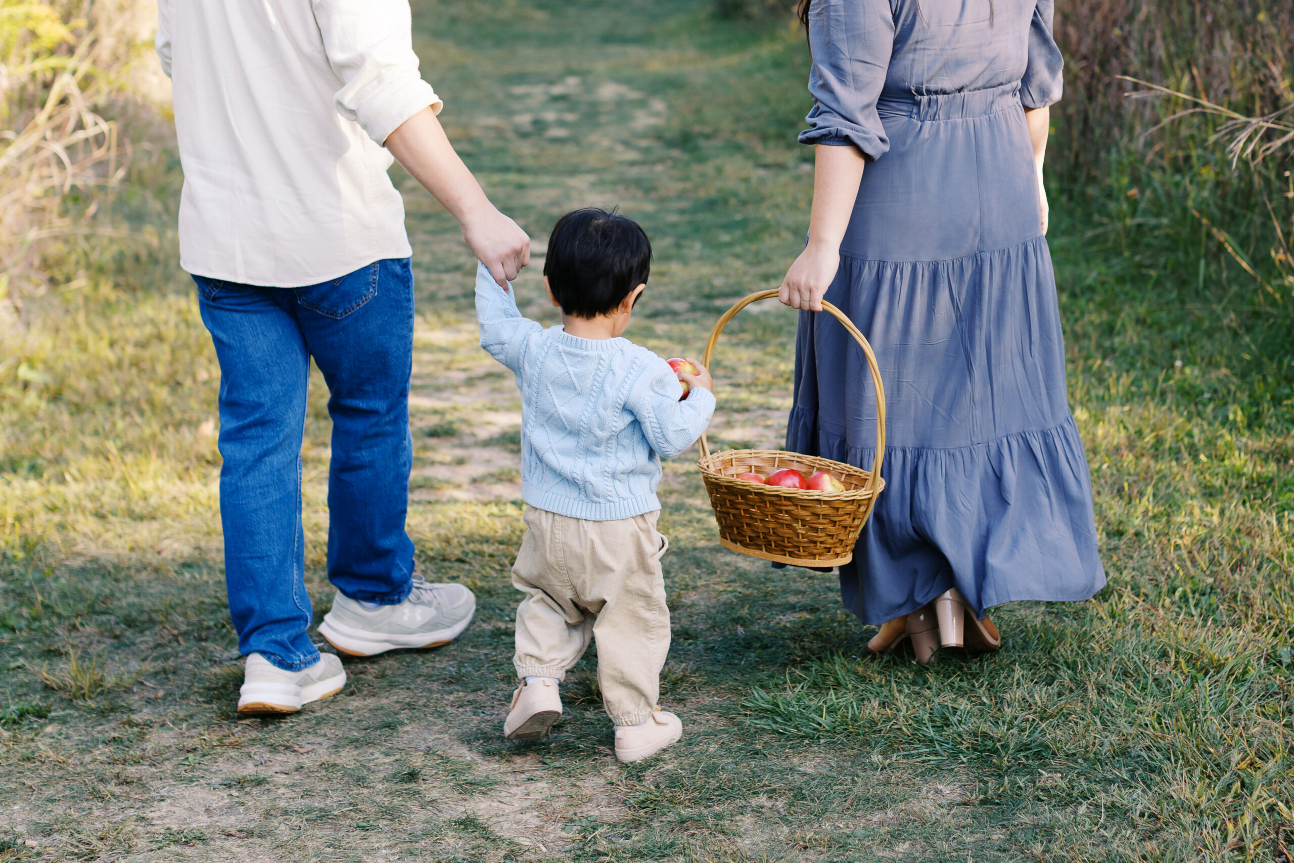 Family holding fruit basket at Starkey Park